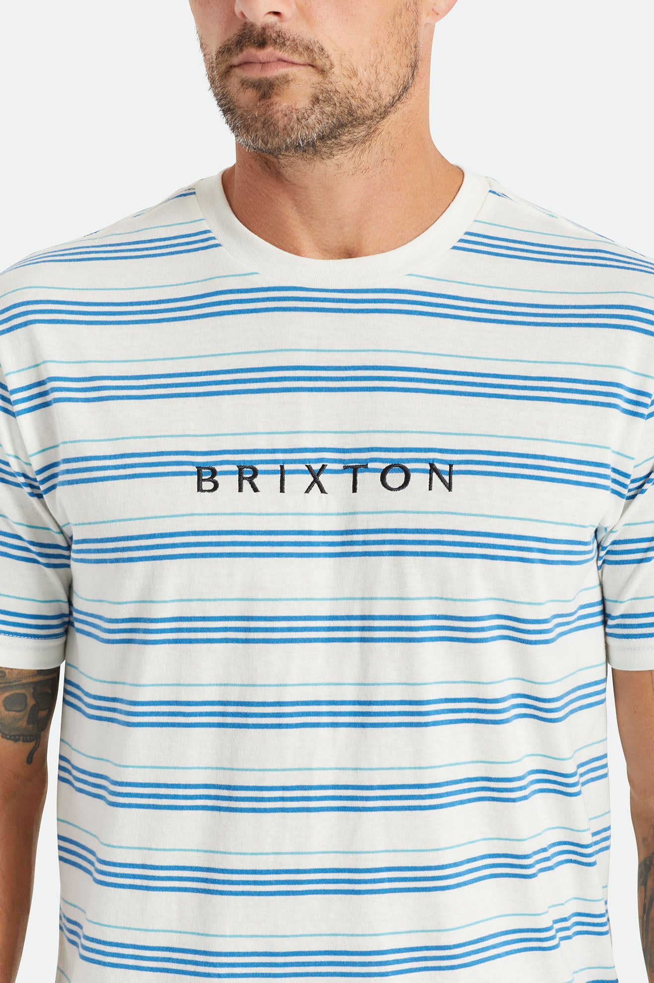 
       Brixton Hilt Alpha Line S/S Knit - Off White/Sky Blue/Teal
     